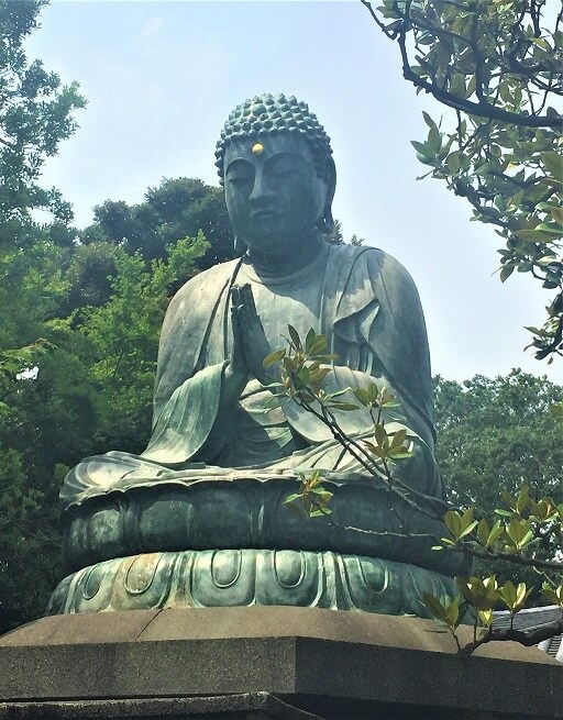 TCM Koeln Buddhastatue Chinesische Medizin Buddhastatue symbolisiert asiatische Weisheit der TCM